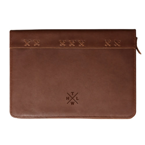A brown leather zippered sleeve with decorative stitched details across the top and an embossed THLW monogram logo near the bottom center, shown against a plain white background.