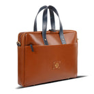 Tan leather briefcase with blue straps on a white background