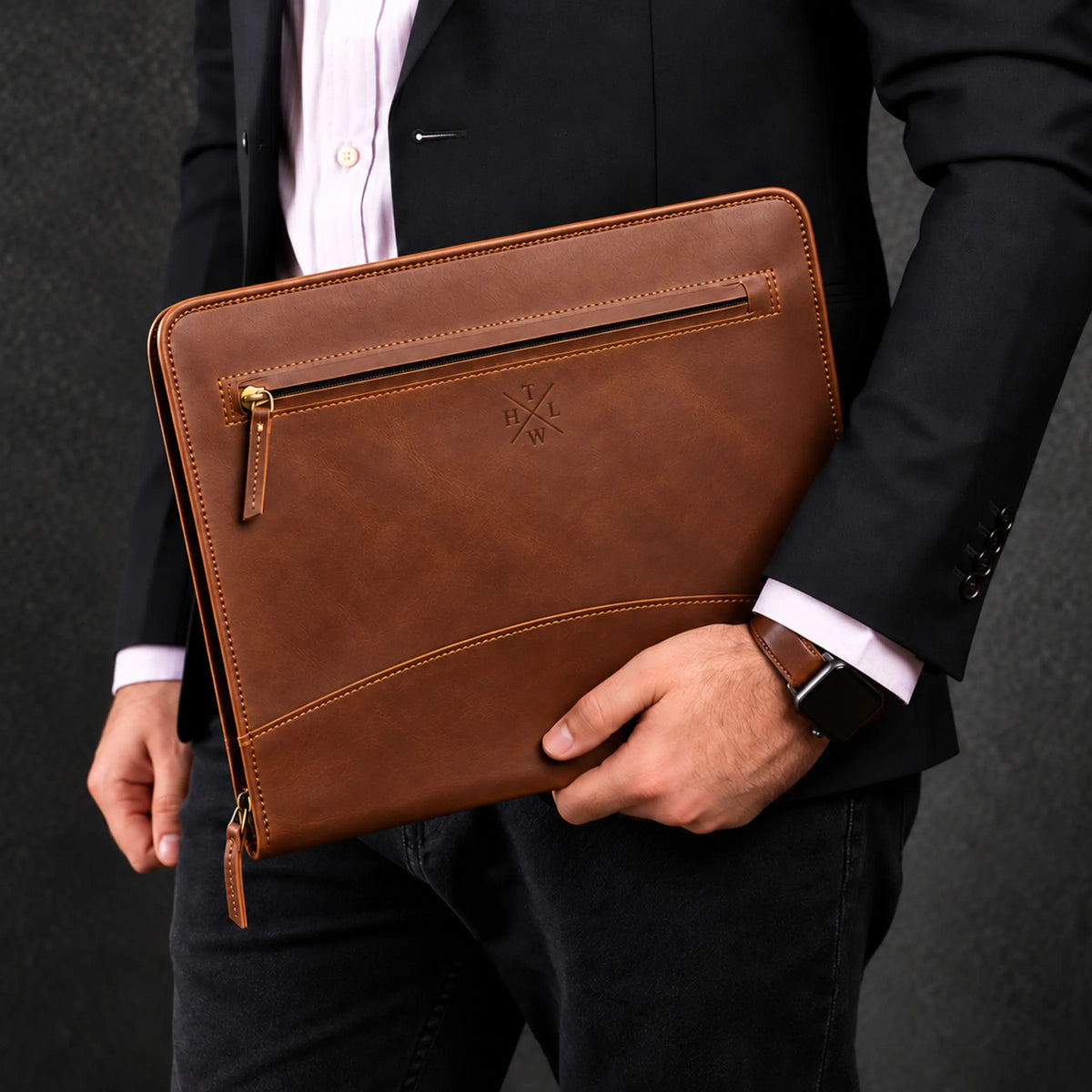 Man in a suit carrying the Executive A4 Leather Folder