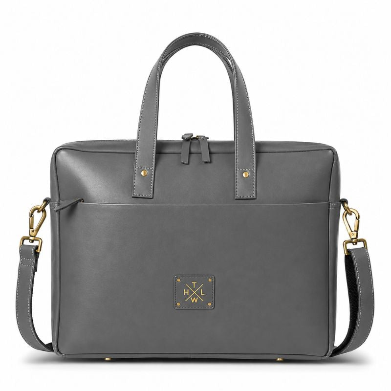 Gray leather laptop bag  with gold accents on a white background