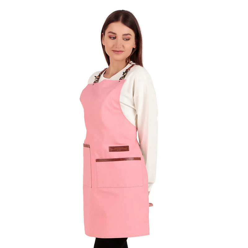 Woman wearing a pink apron on a white background