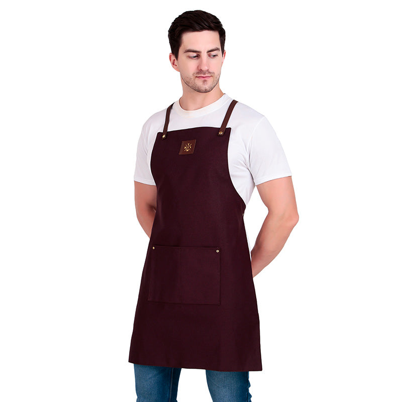 Man wearing a maroon apron on a white background