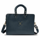 Navy blue handbag with gold accents on a white background