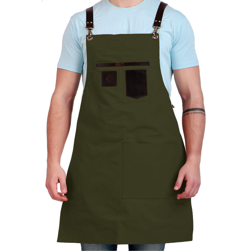 Person wearing a green apron with brown straps on a white background