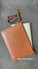 tan leather laptop sleeve with the handle 