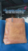 showing leather tote bag