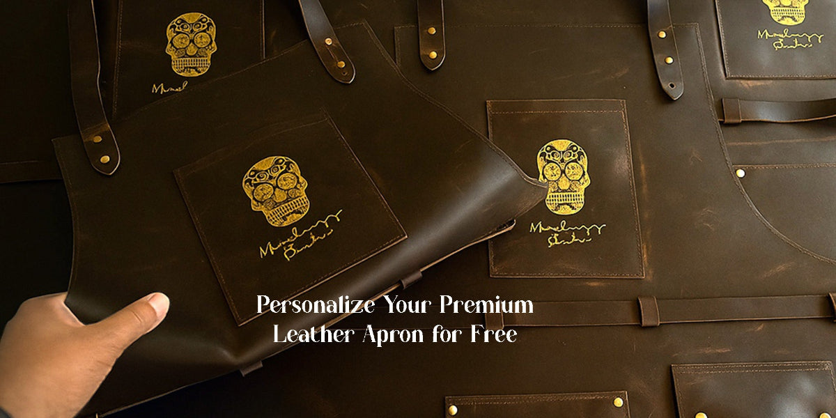 Brown leather aprons with gold logos and text, one held by a hand.